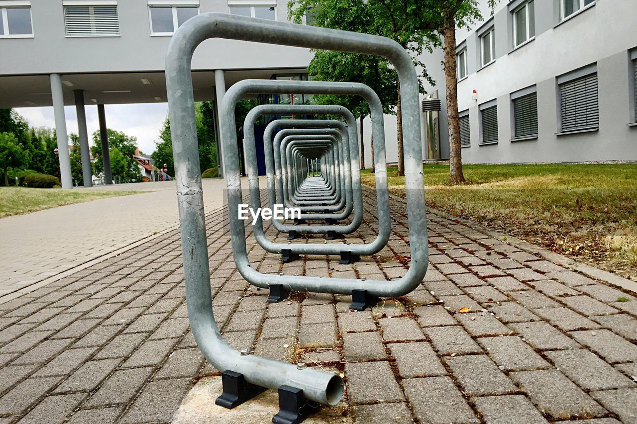 Empty bicycle rack on footpath