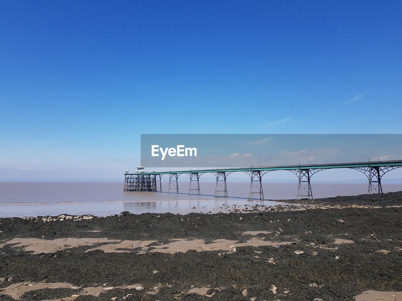 Scenic view of sea against blue sky