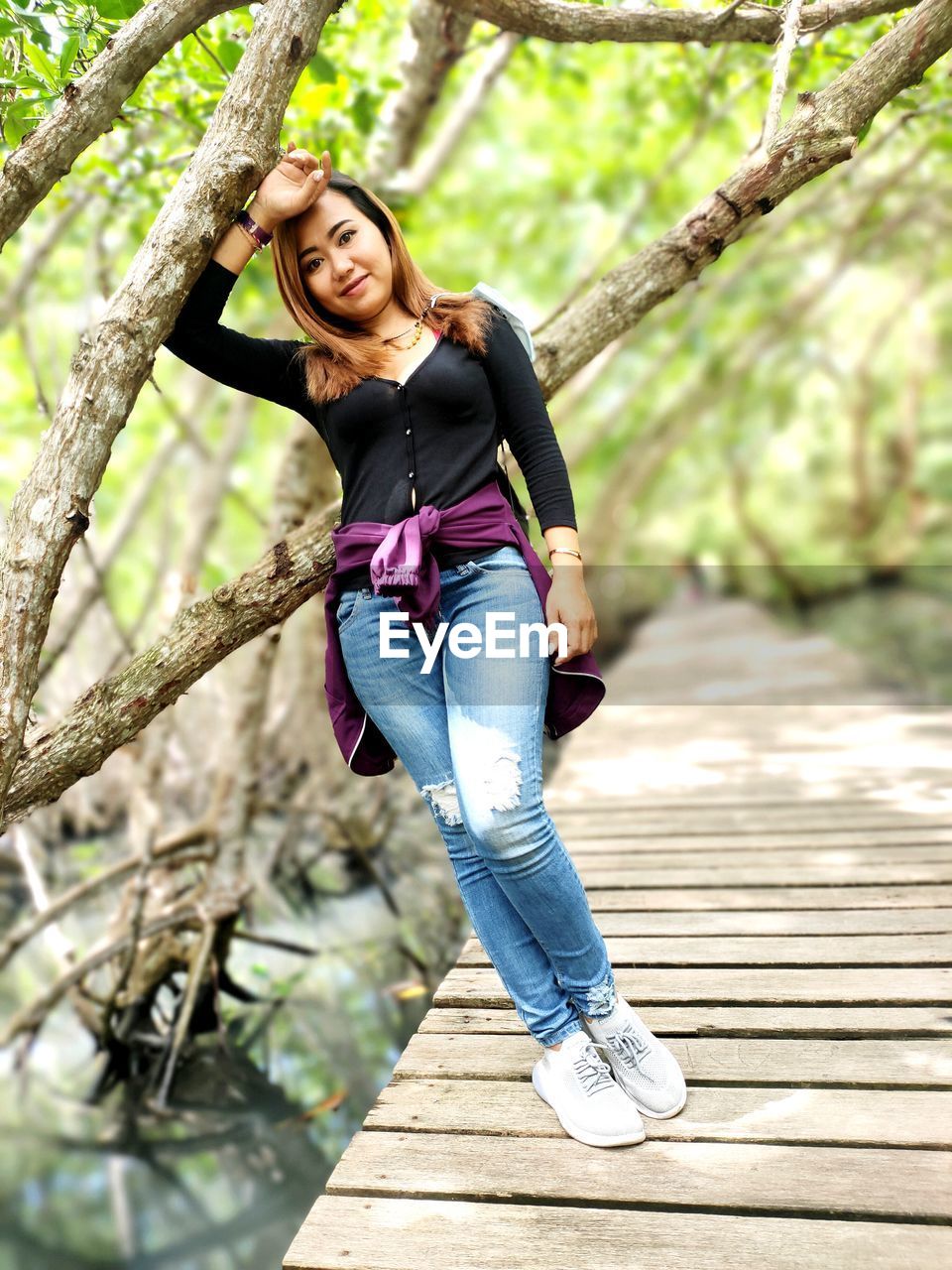 Portrait of smiling woman on the mangrove, love it