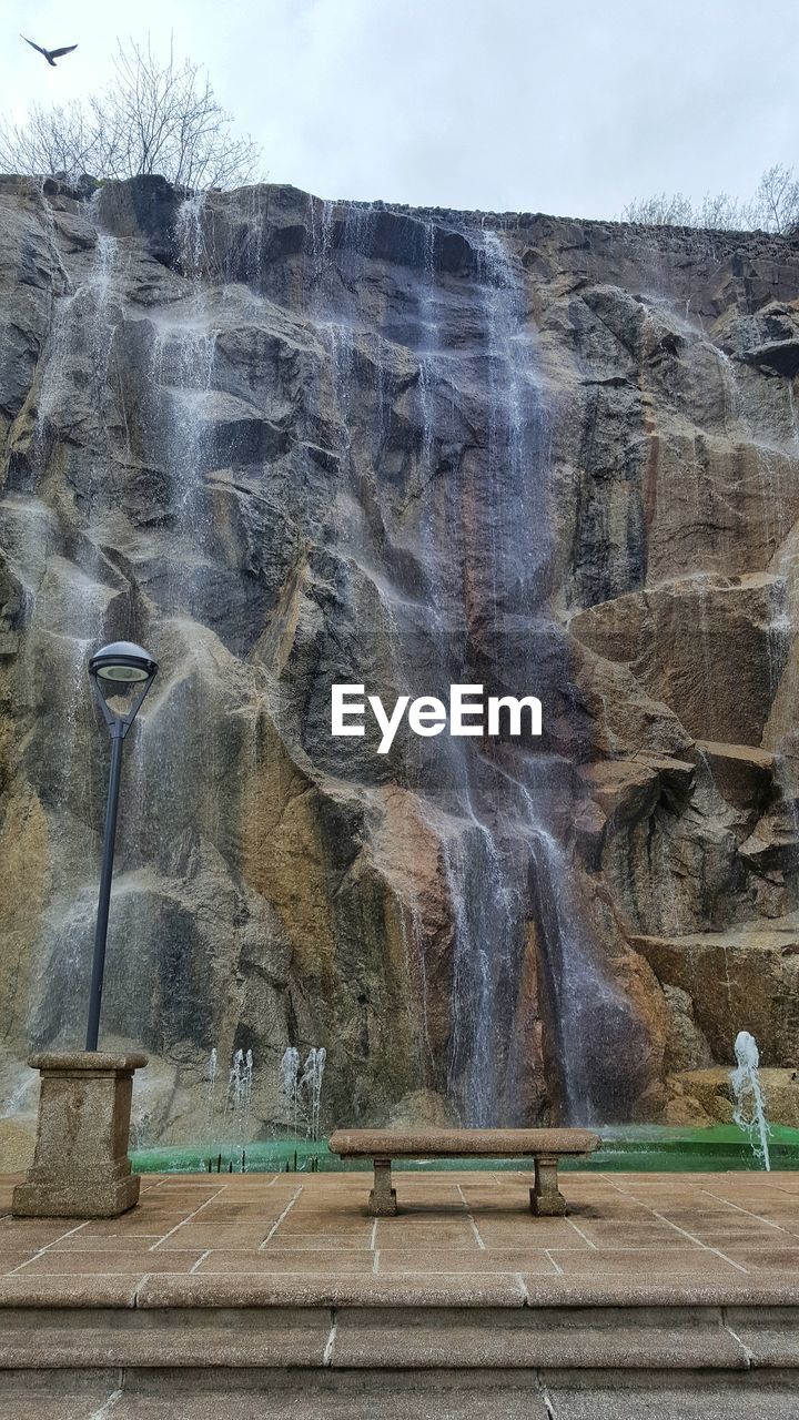 Waterfall along rocky wall