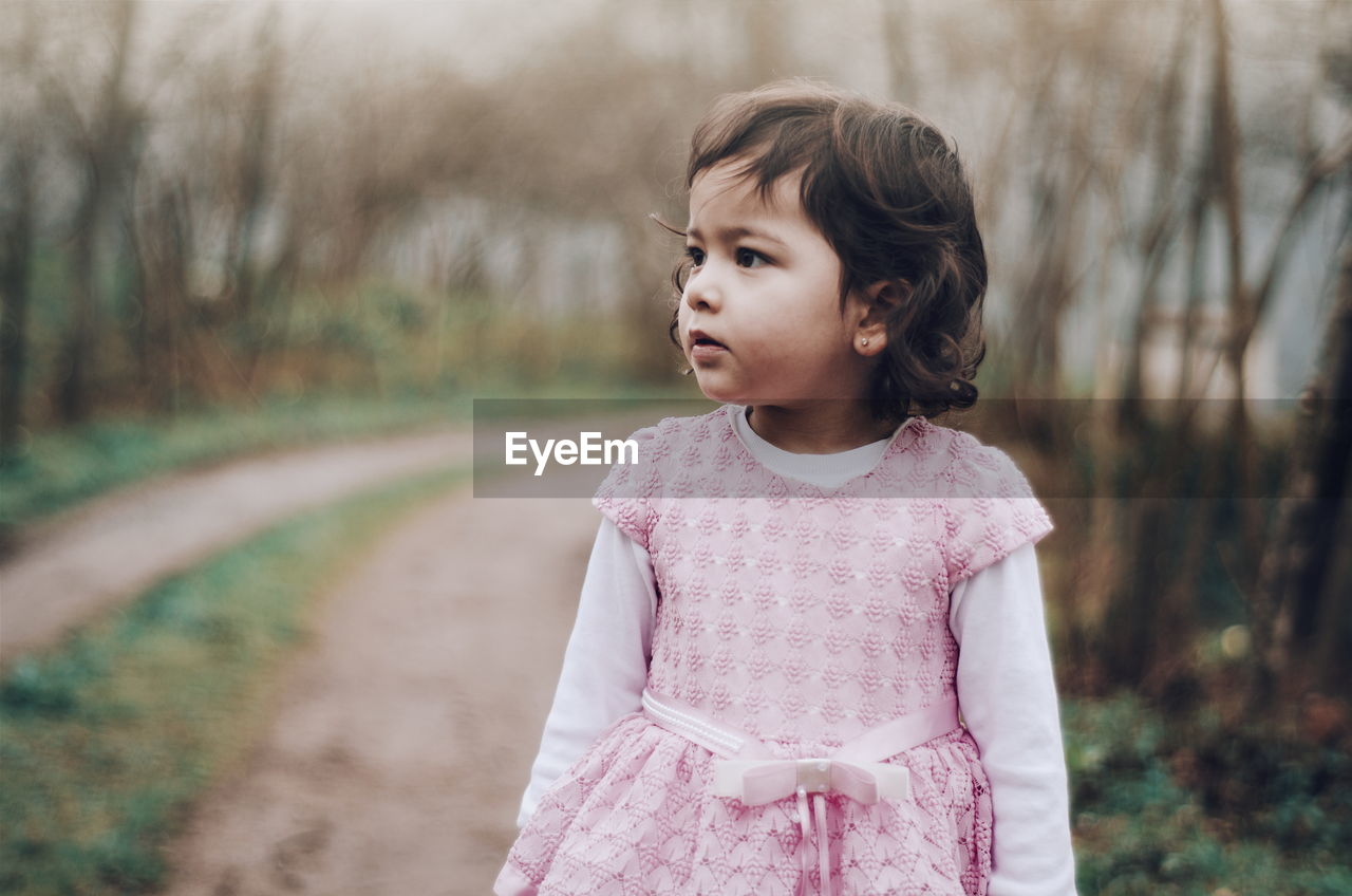 Innocent girl standing on road