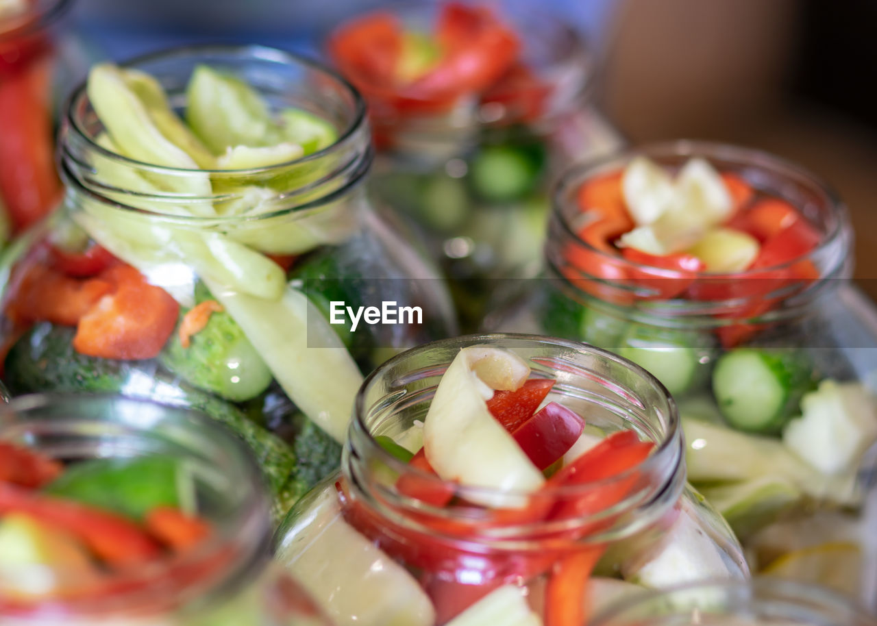 Close-up of fruits in glass jar on table