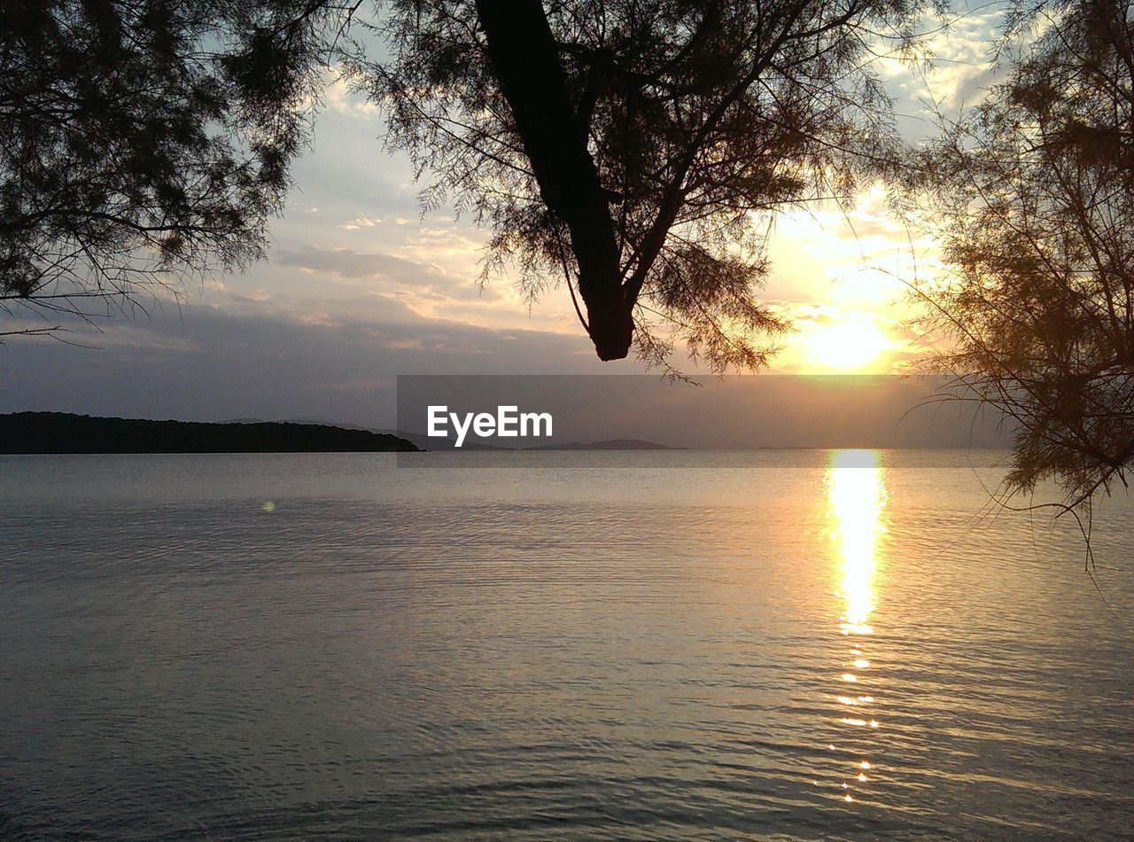 Scenic view of sunset over calm sea