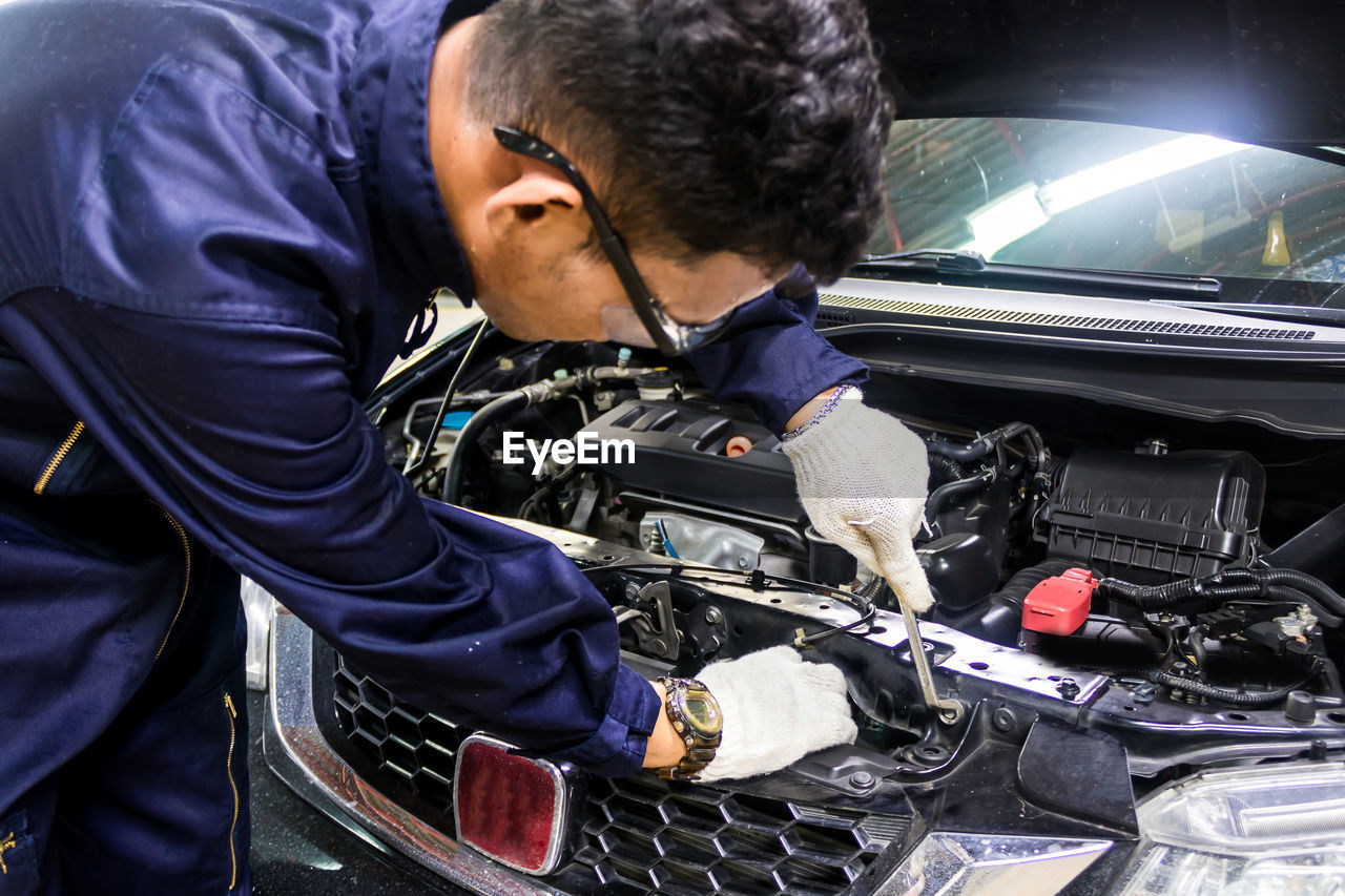 Mechanic repairing car in auto repair shop