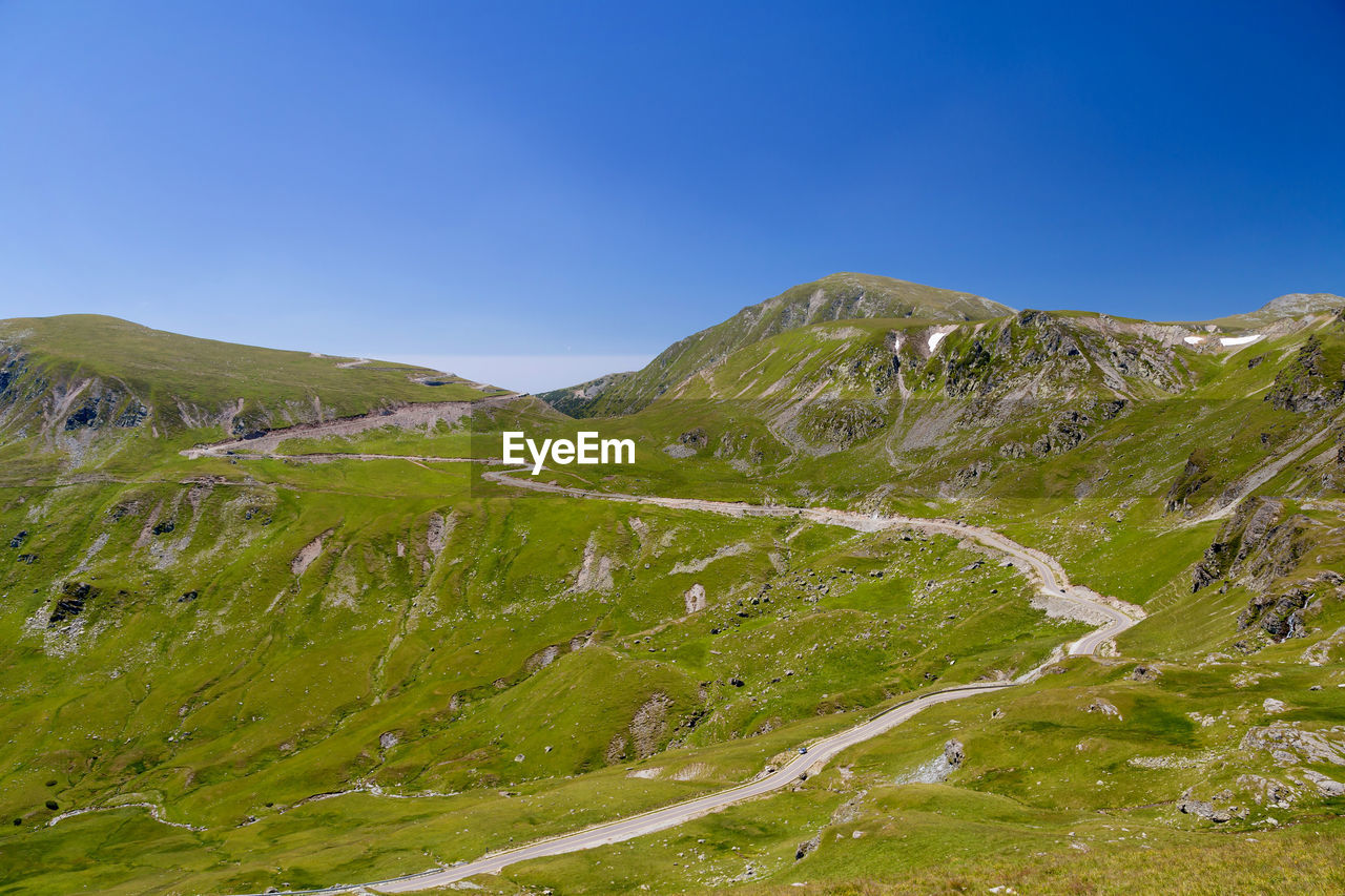 Scenic view of landscape against clear blue sky