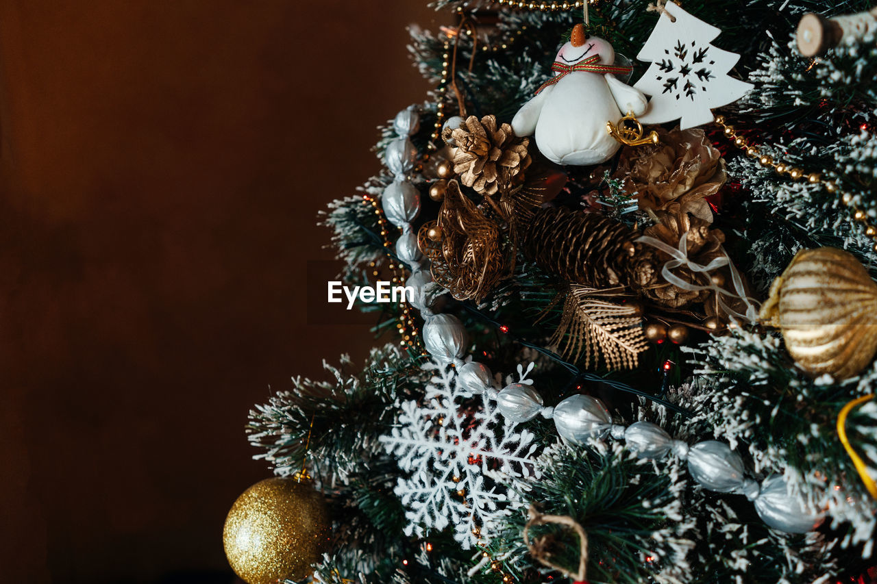 Decorated christmas tree with balls, beads, baubles.