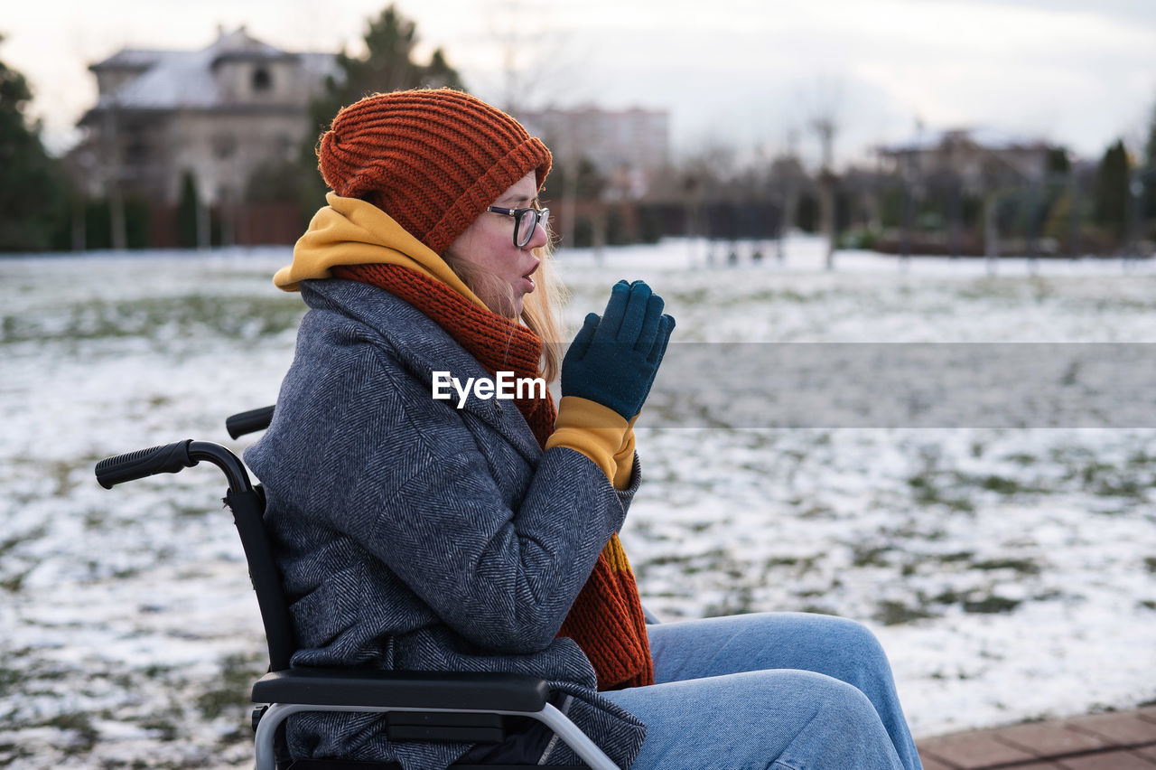 rear view of woman using mobile phone