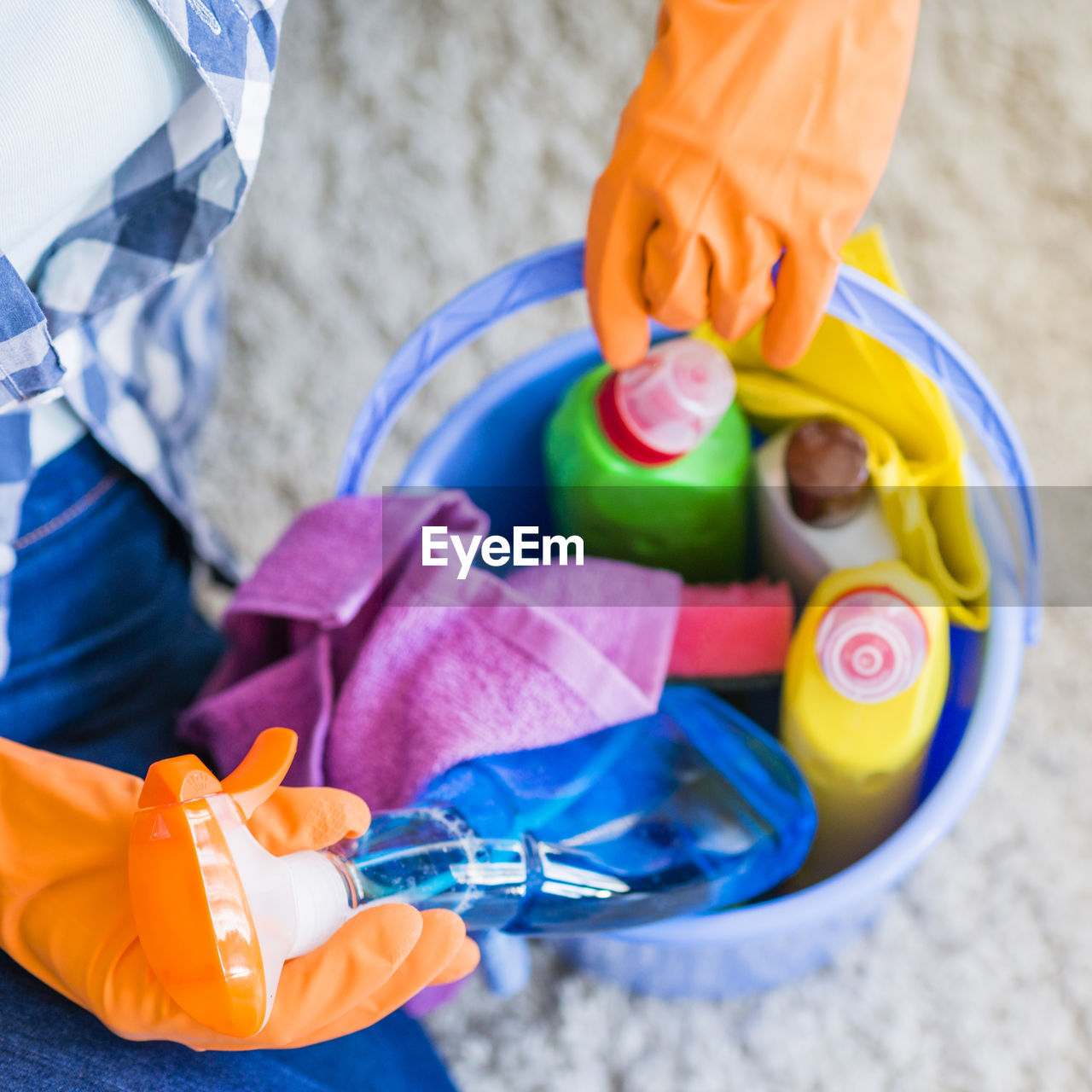 protective glove, protective workwear, childhood, adult, child, protection, hand, toddler, indoors, domestic life, women, holding, one person, toy, lifestyles, cleaning, high angle view, washing up glove, yellow, close-up, female