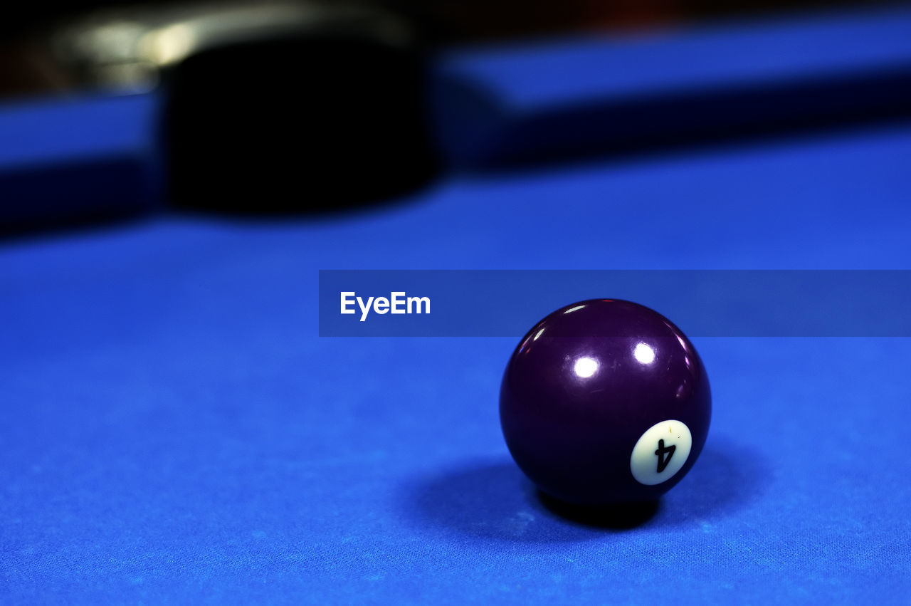 Close-up of blue ball on pool table