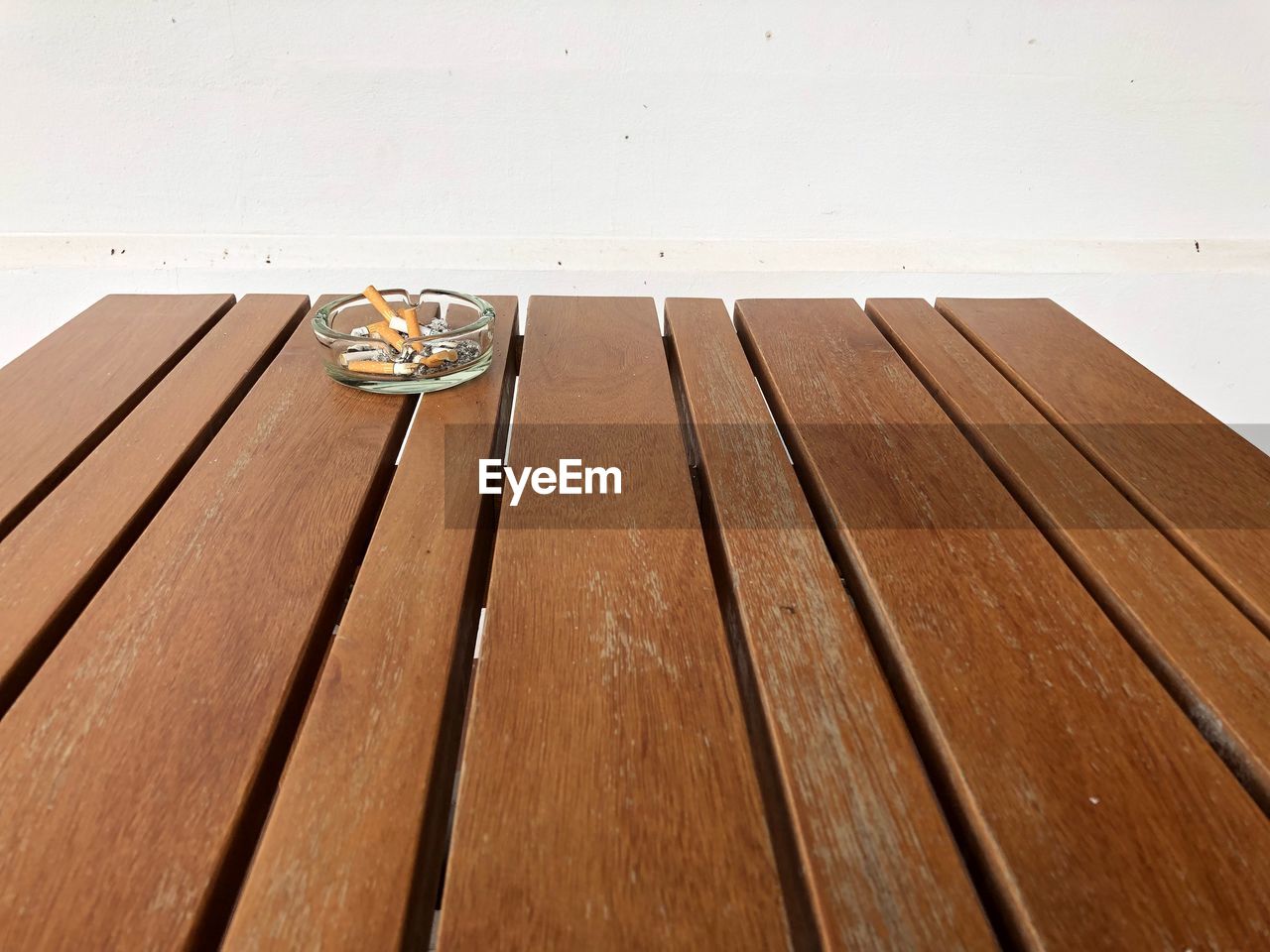 HIGH ANGLE VIEW OF WOODEN TABLE ON FLOOR