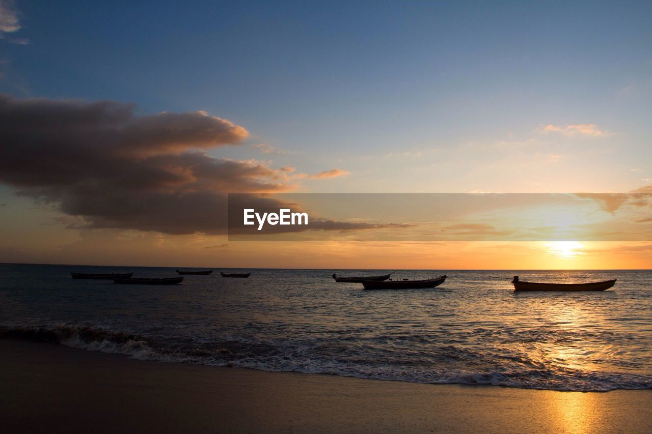 Scenic view of sea at sunset