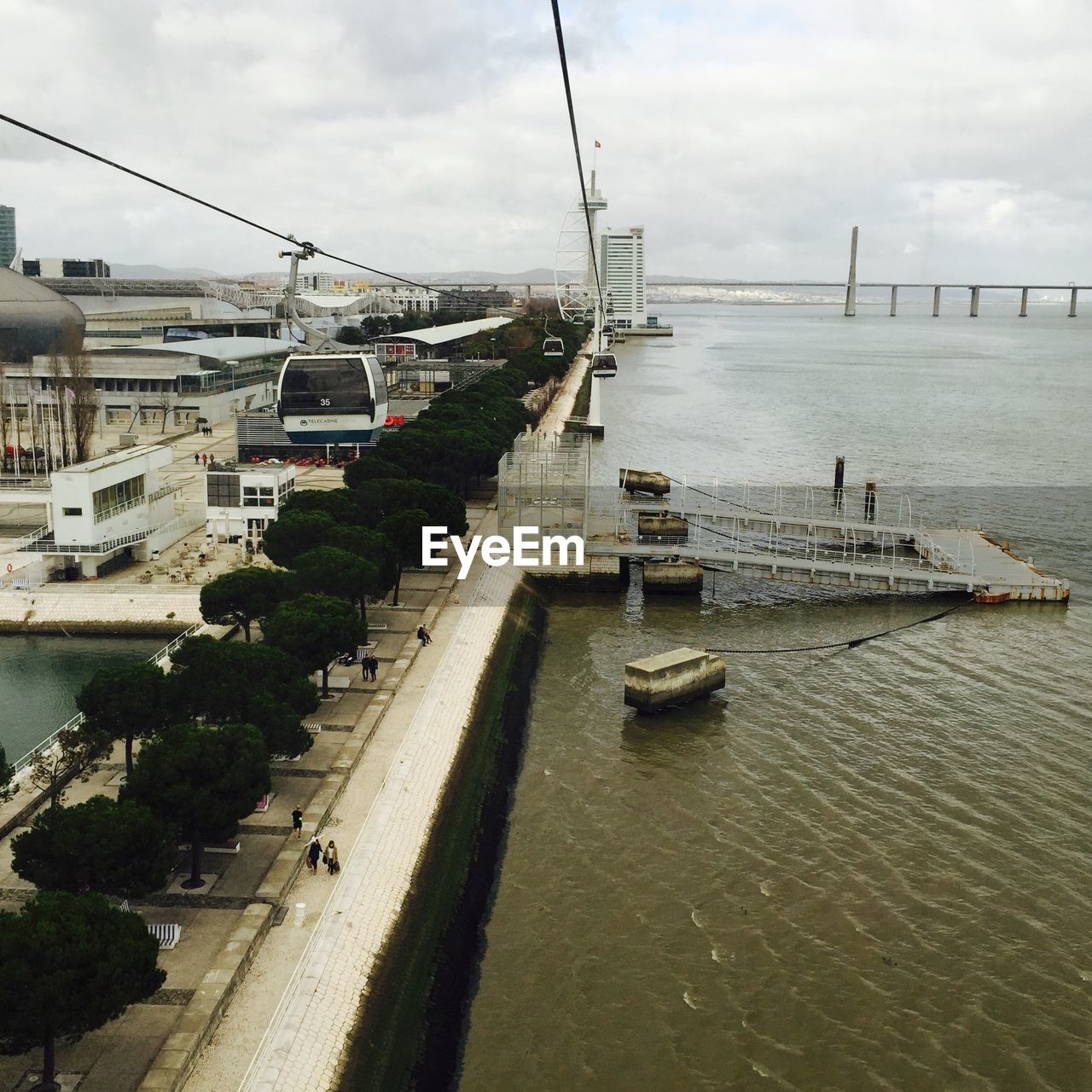 VIEW OF RIVER AGAINST CLOUDY SKY