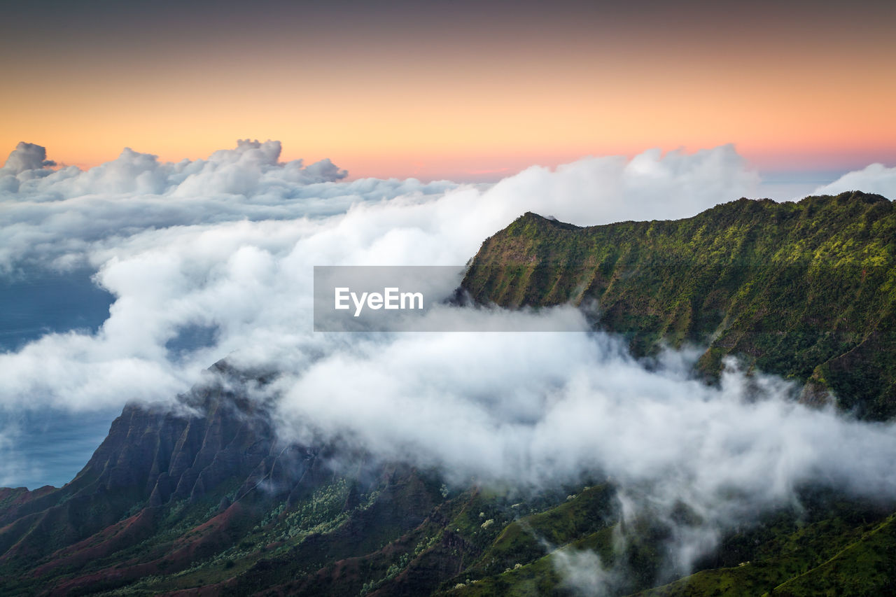 Scenic view of clouds over mountain against sky