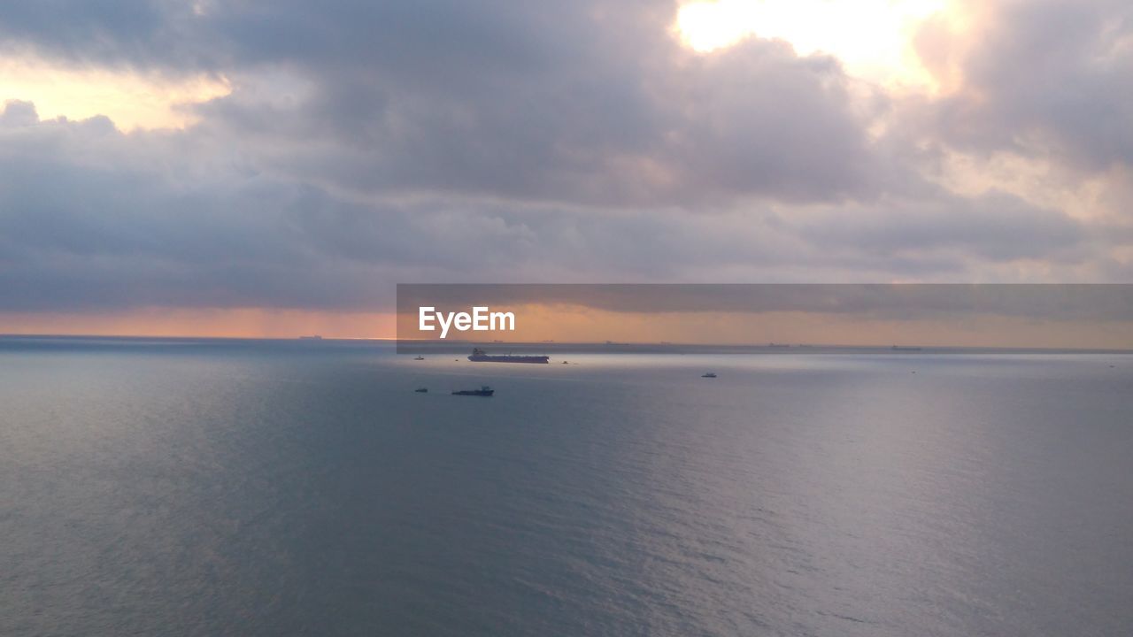 Scenic view of sea against sky at sunset