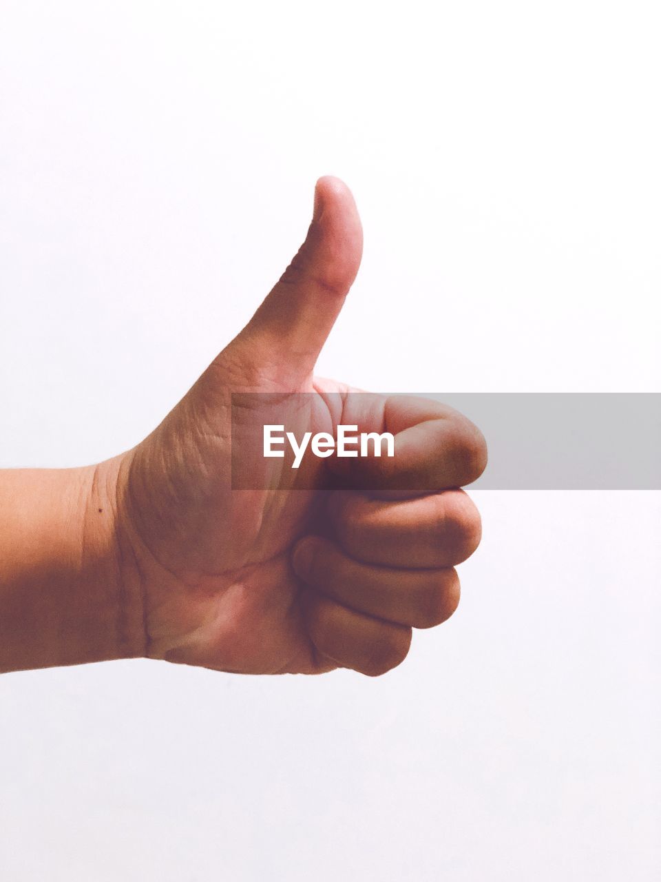 Close-up of human hand against white background