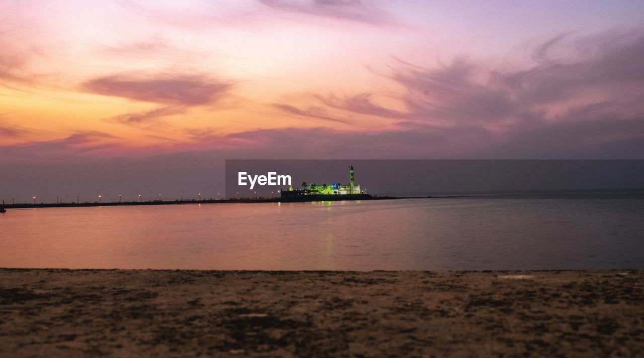 SCENIC VIEW OF SEA AGAINST ORANGE SKY