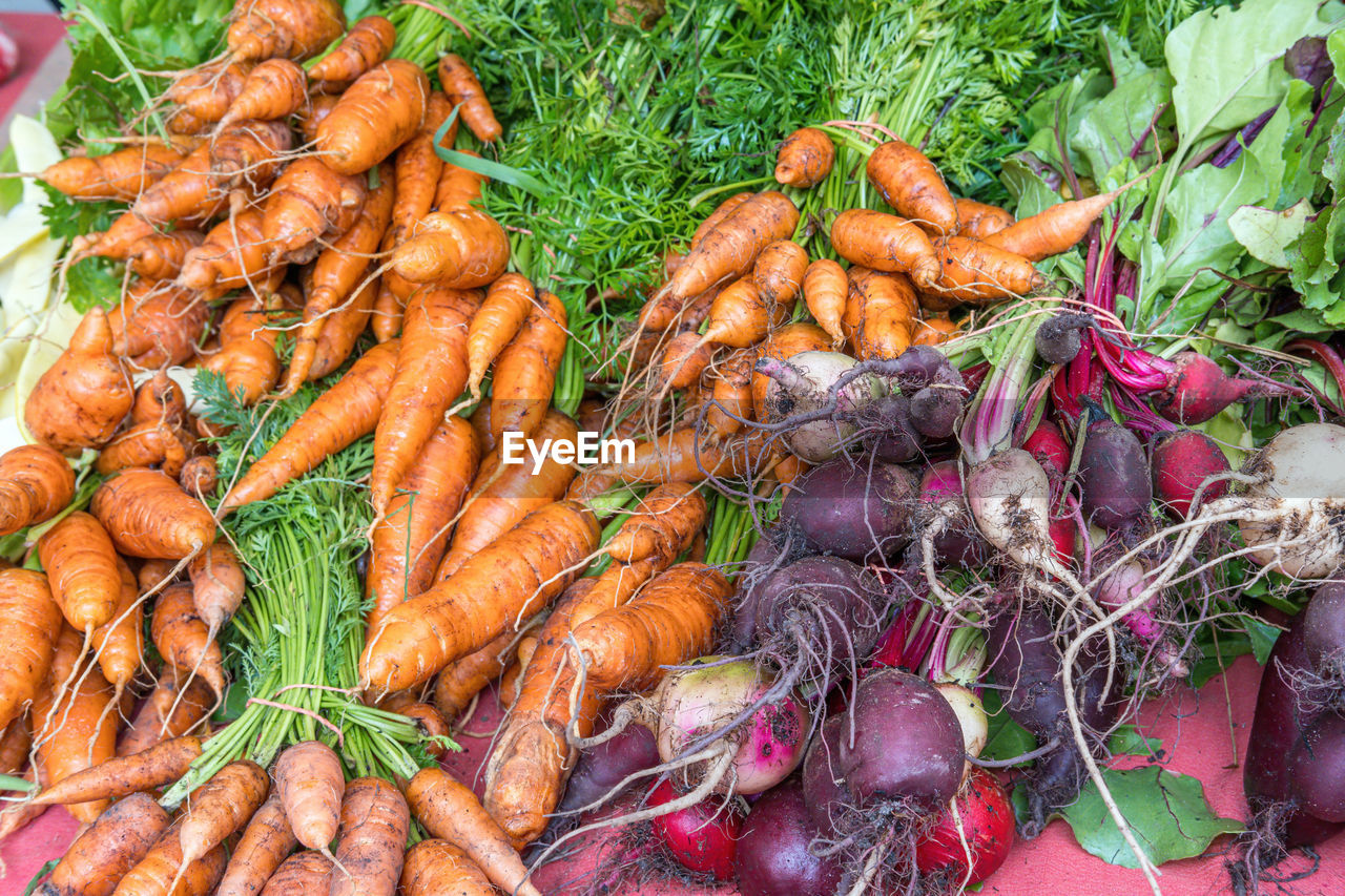 Carrots, radish and beetroot for sale at a market