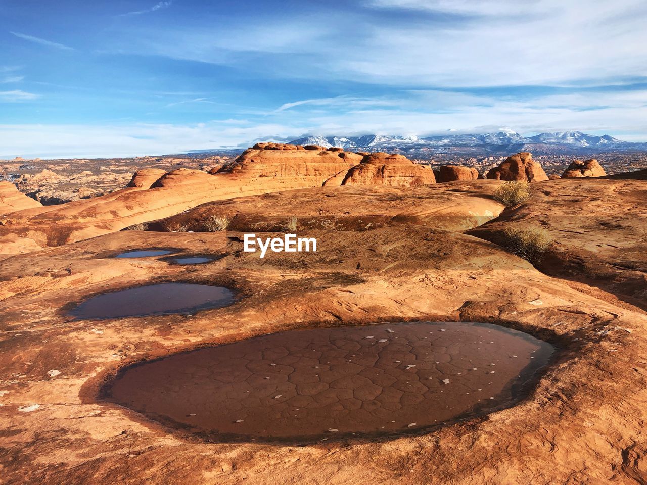 Rock formations on landscape against sky