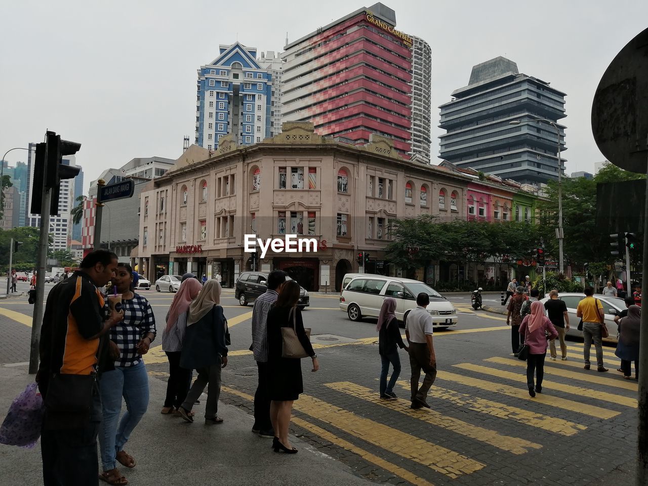 GROUP OF PEOPLE ON CITY STREET