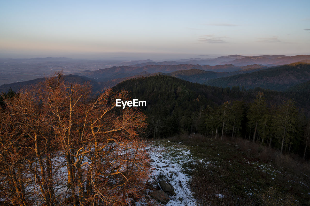 Scenic view of mountains against sky during sunset