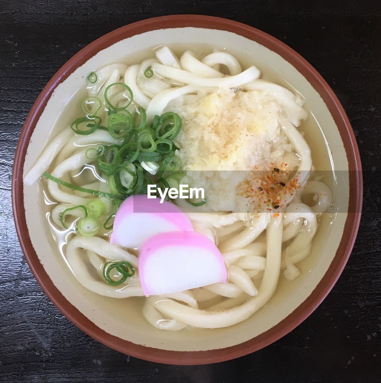 Close-up of udon noodles served on table