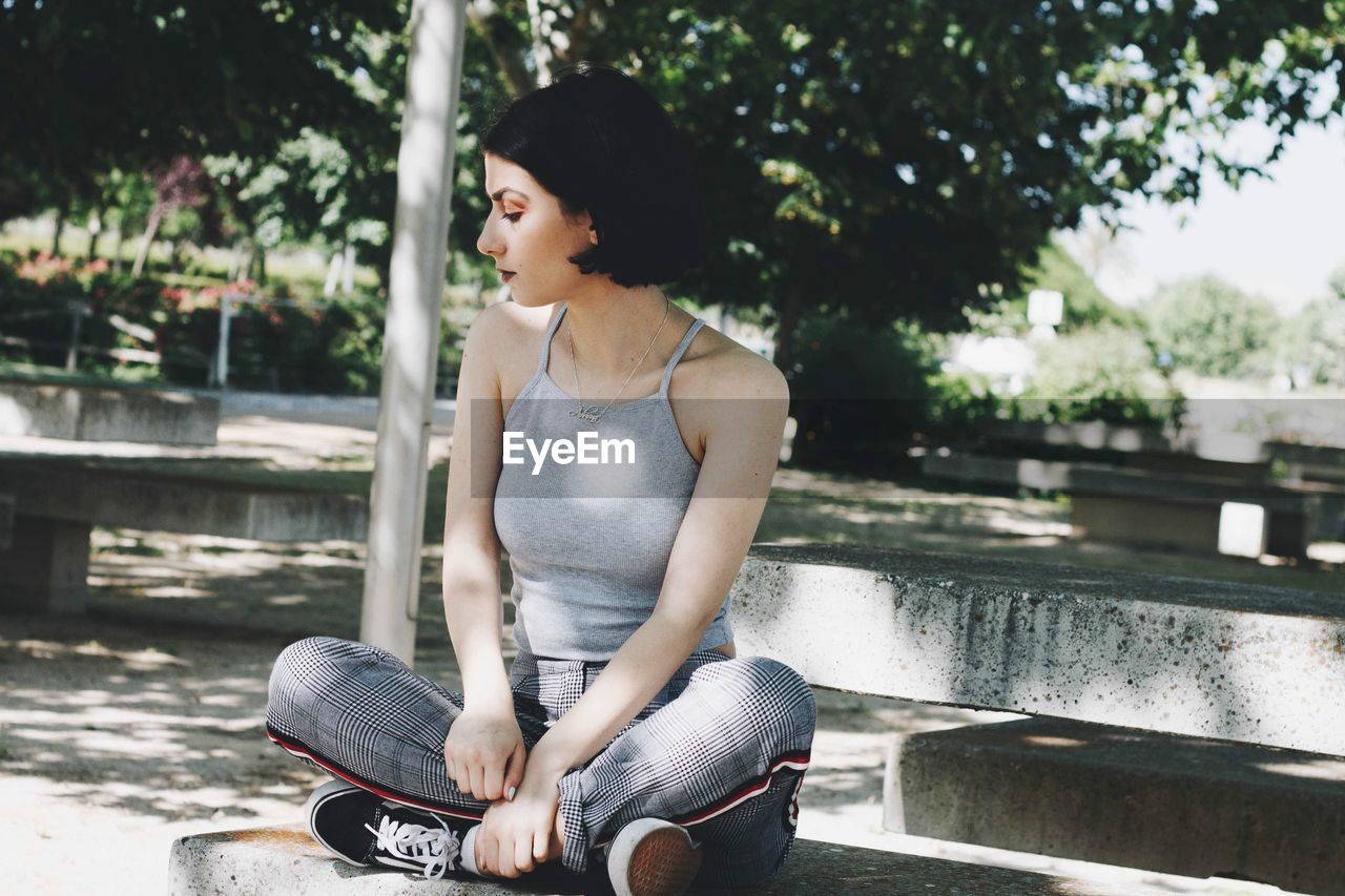 Woman sitting on road