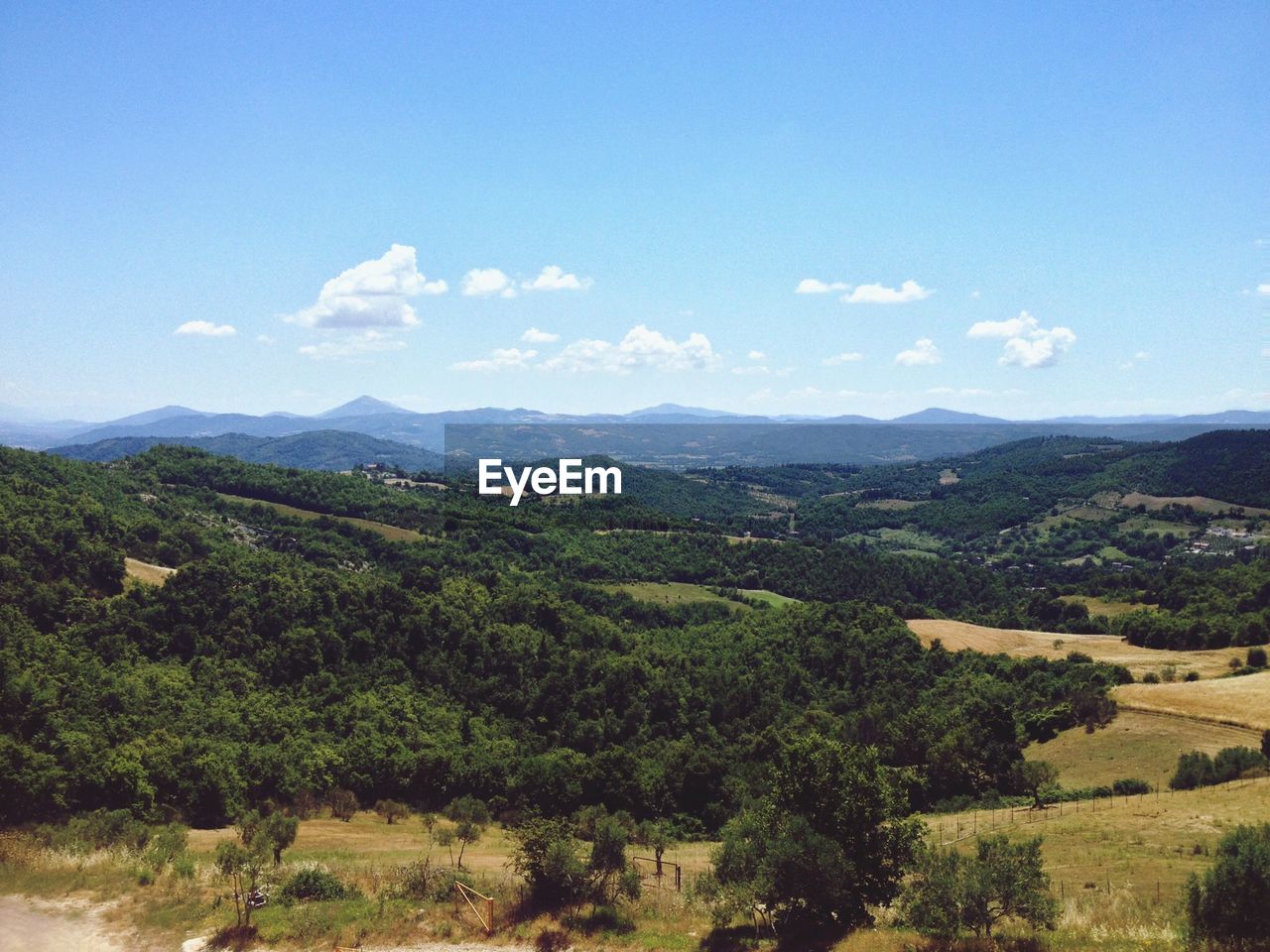 Countryside landscape against blue sky