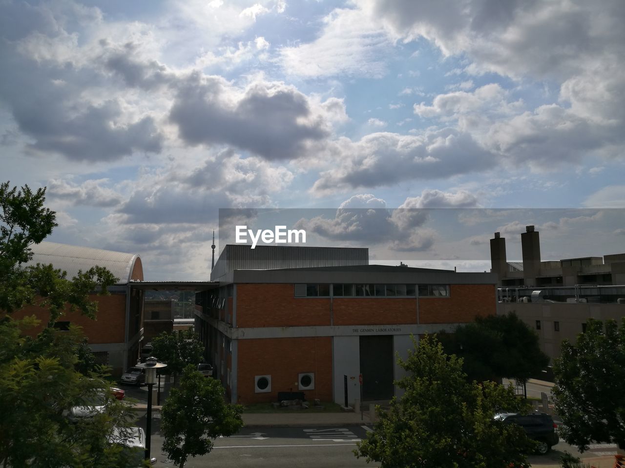 HOUSES AND TREES AGAINST SKY