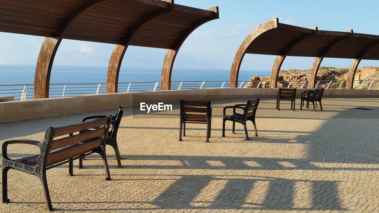 CHAIRS AND TABLE ON BEACH