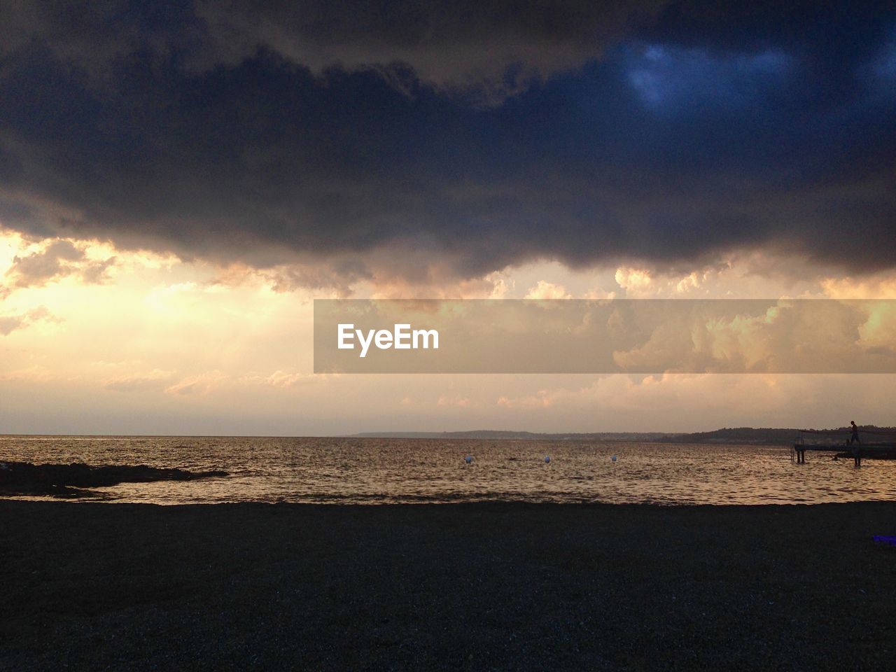 SEA AGAINST SKY AT SUNSET