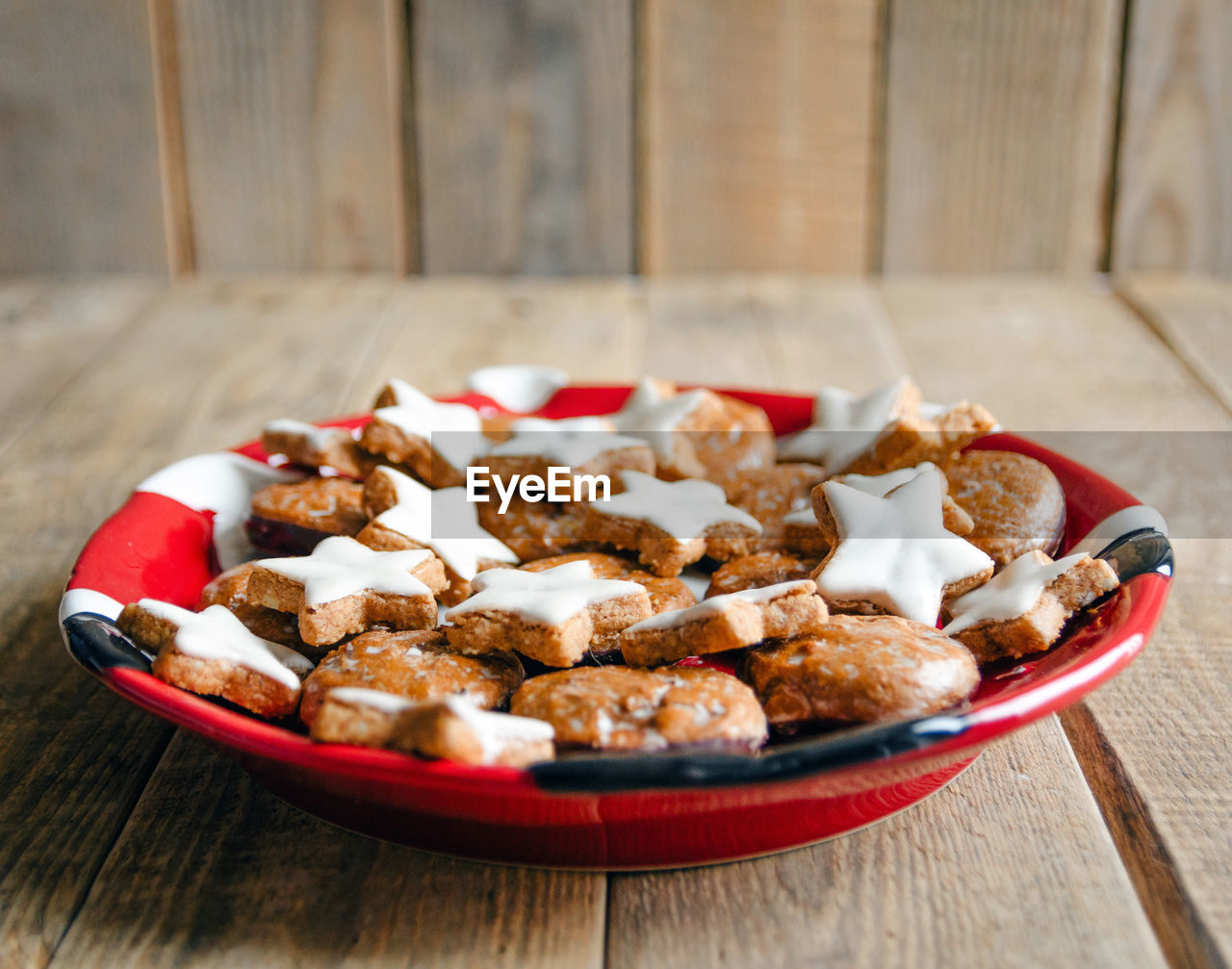 Plate with gingerbread christmas cookies on a plate. wooden background.