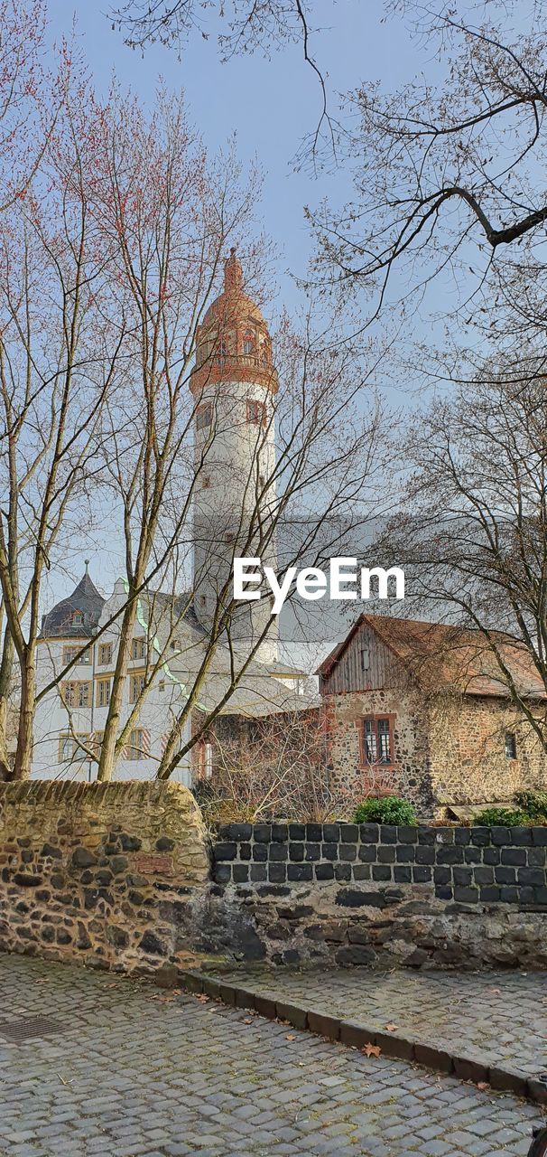 VIEW OF BUILDINGS BY RIVER