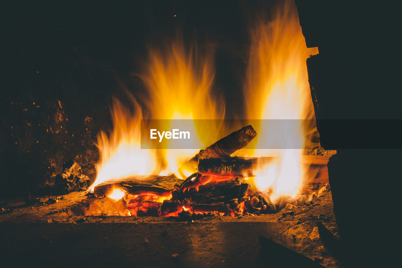 Bonfire on log at night
