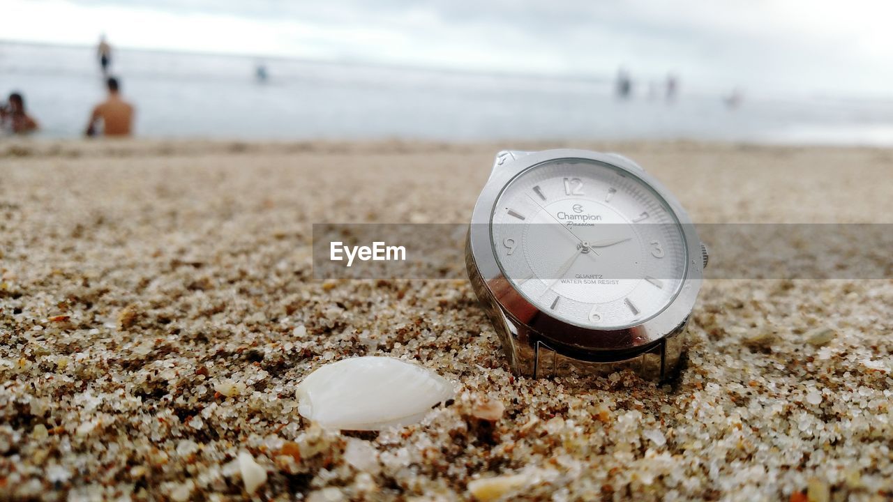 CLOSE-UP OF CLOCK ON SHORE