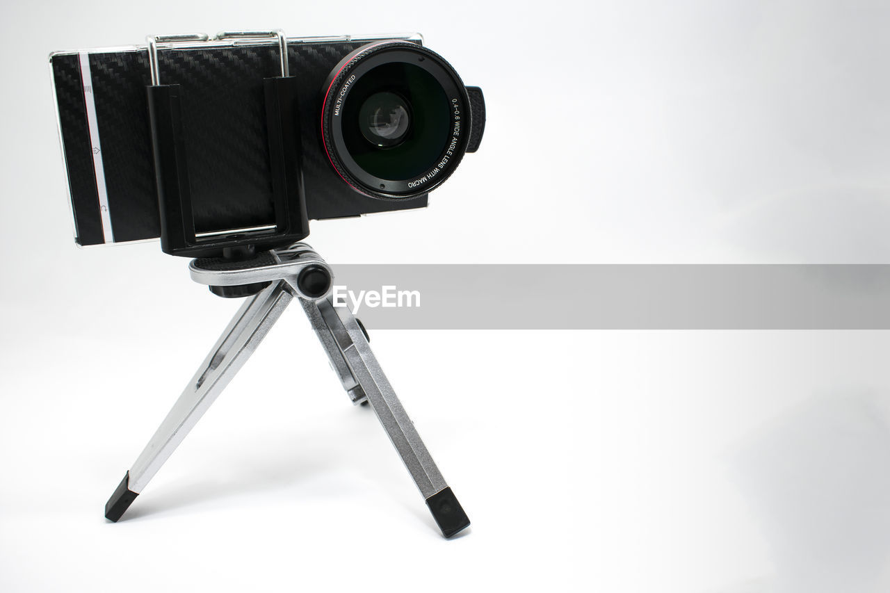 Close-up of camera against white background