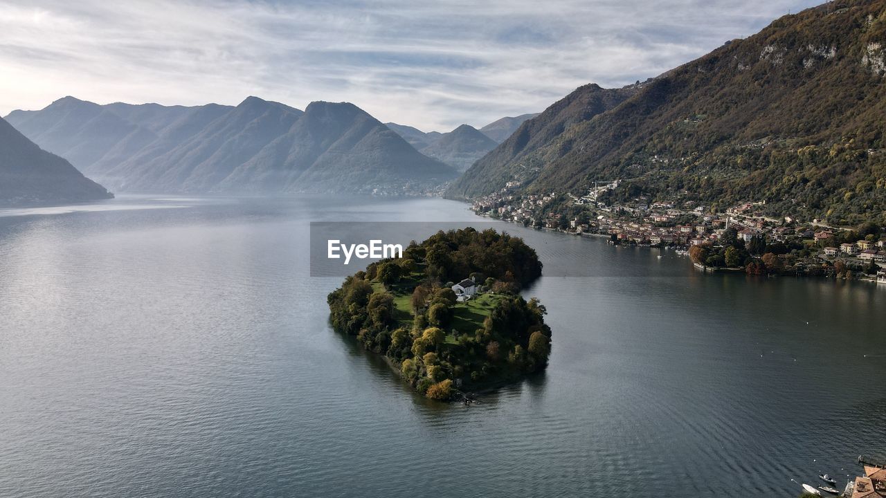 Scenic view of como lake  omacina island and mountains against sky