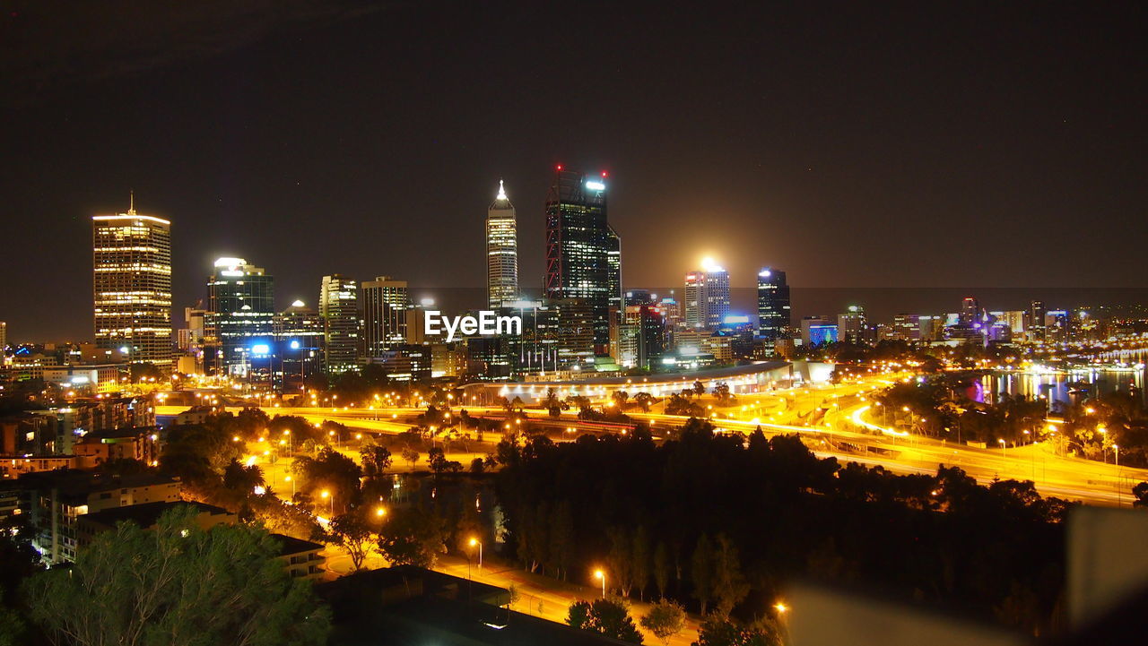 High angle view of illuminated buildings in city at night