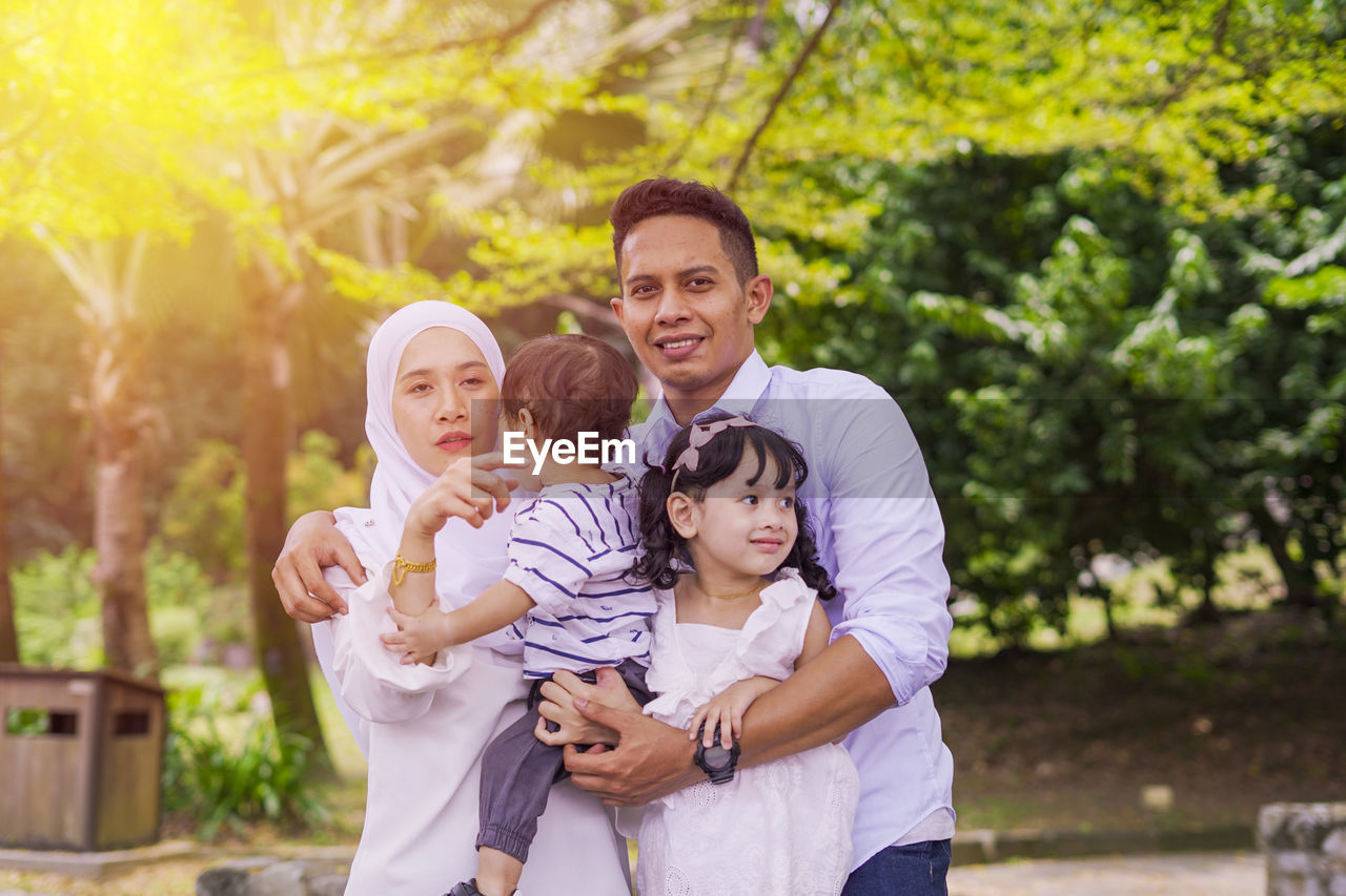 Parents with children in park