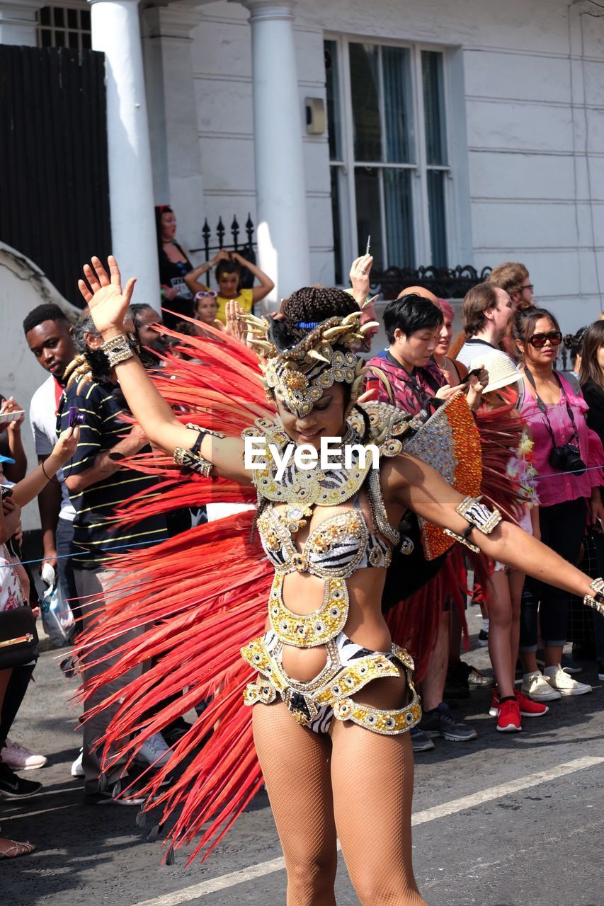 Dancer, London School of Samba Composition Feathers Fun GB London Arts Culture And Entertainment Capital City Carnival Carnival Costume Dancer Dancing Famous Carnival Front View Full Frame Headdress Incidental People London School Of Samba Nottinghill Carnival 2017 Outdoor Photography Performance Performing Arts Event Raised Arms Red, Gold And Black Colour Uk Young Woman