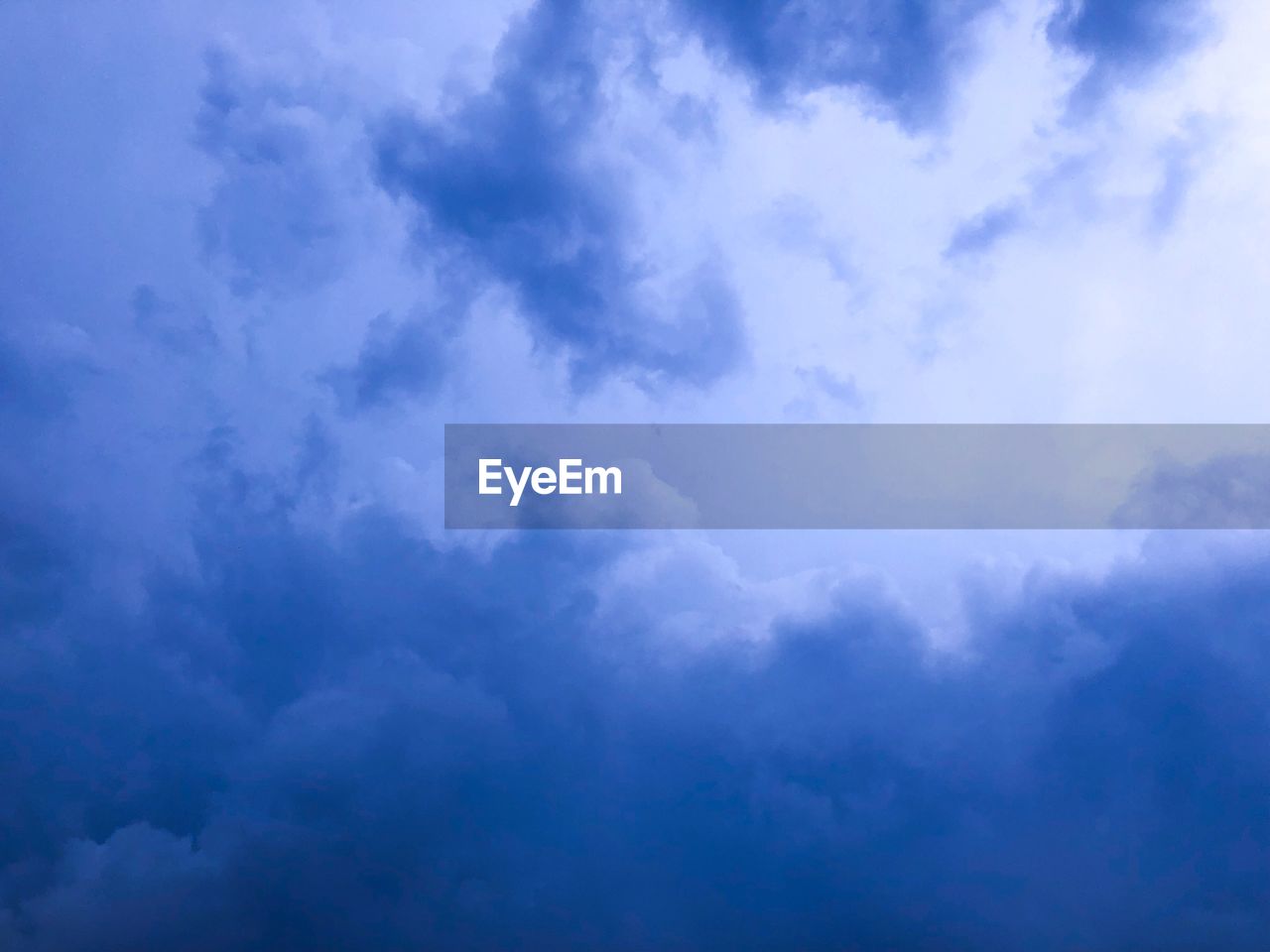 LOW ANGLE VIEW OF CLOUDS IN BLUE SKY