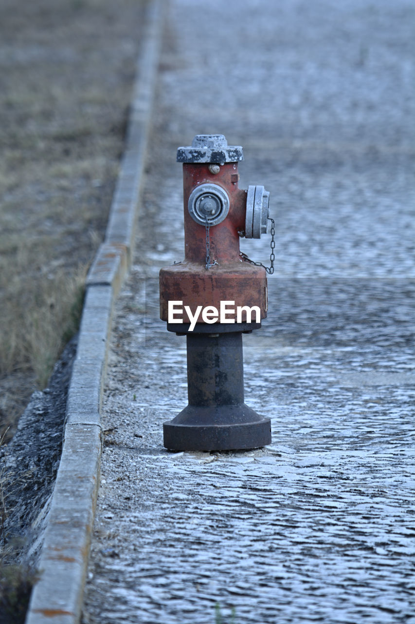 water, fire hydrant, day, no people, nature, outdoors, metal, sea, focus on foreground, blue, winter, security, street