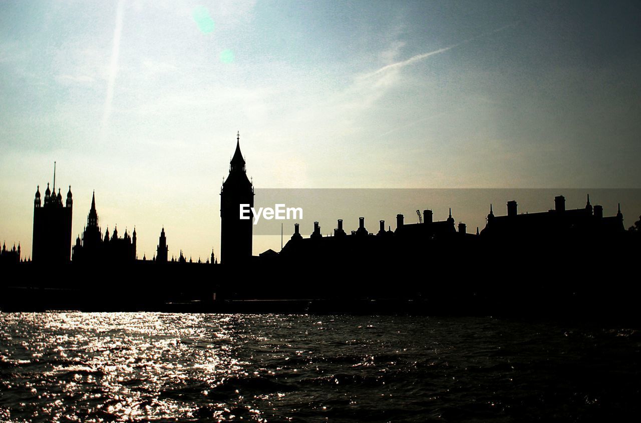 SILHOUETTE OF CITY AT WATERFRONT