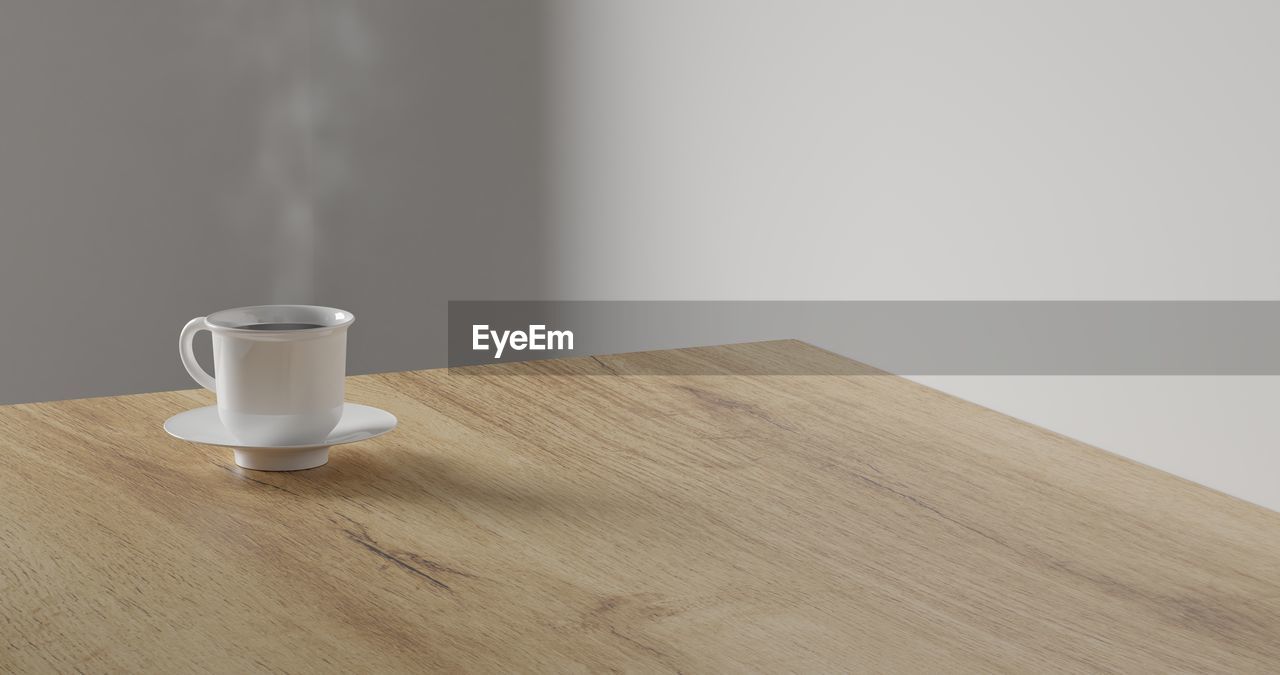 HIGH ANGLE VIEW OF COFFEE CUP ON TABLE