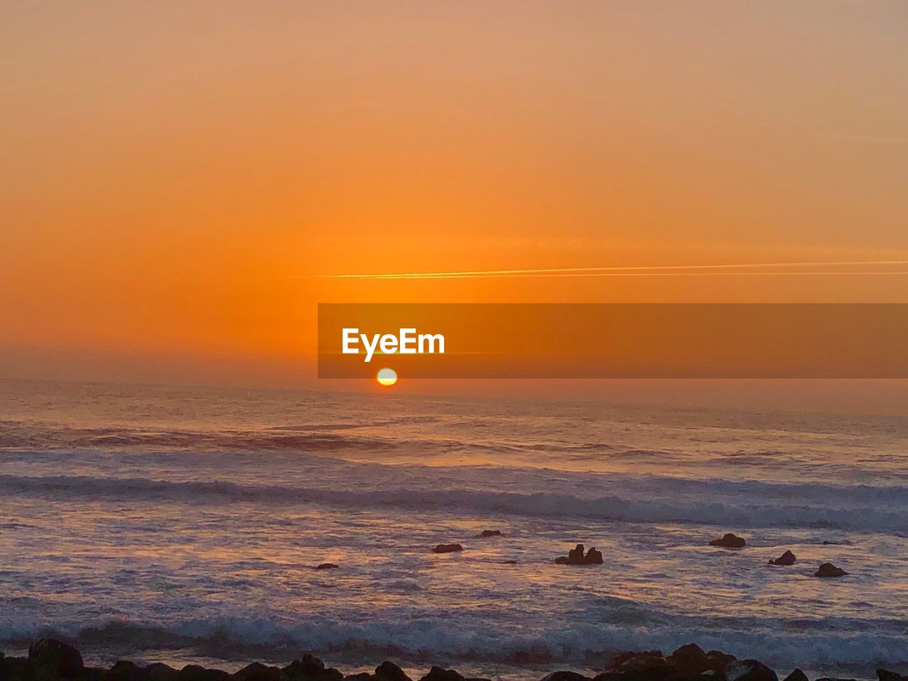SCENIC VIEW OF SEA DURING SUNSET