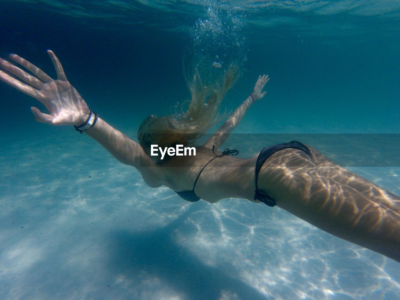 Woman swimming in undersea