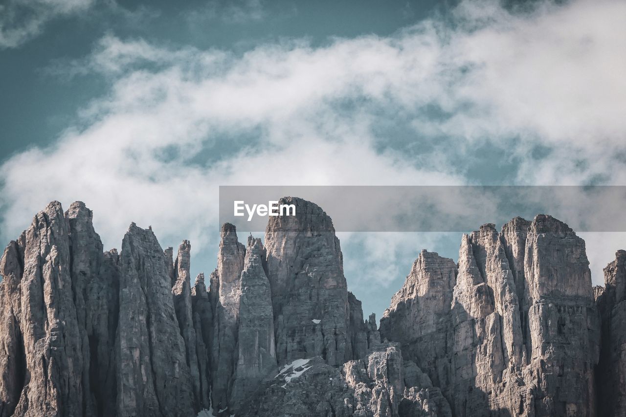 Panoramic view of rocky mountains against sky