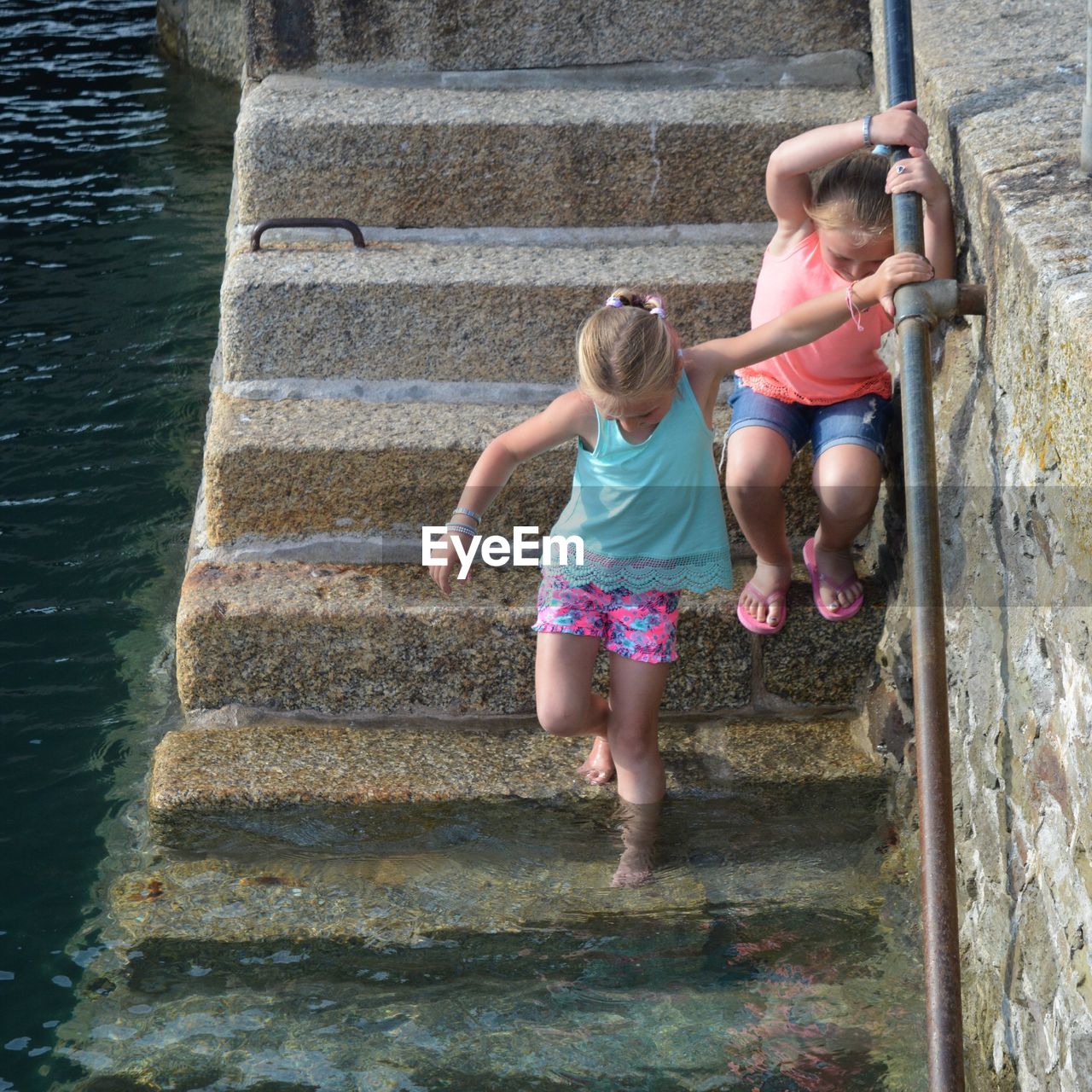 Down the steps to the water - sisters