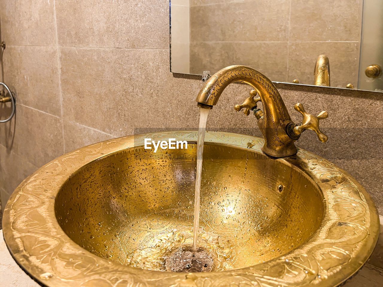 bathroom, home, faucet, domestic room, household equipment, sink, water, plumbing fixture, indoors, hygiene, domestic bathroom, metal, tap, home interior, food and drink, nature, tile, washing, no people, refreshment, cleaning, flooring, wash bowl, close-up, motion, purity, running water, gold
