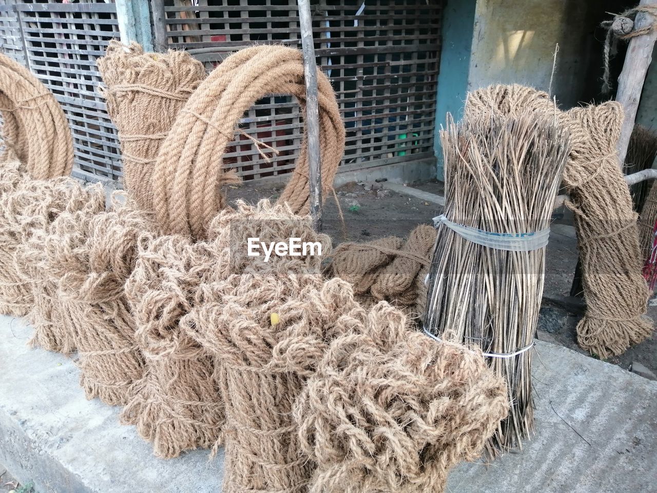fishing industry, no people, fishing net, rope, fishing, day, large group of objects, art, basket, for sale, abundance, commercial fishing net, wood, high angle view, textile, container, still life, outdoors, tied up, business, market, straw