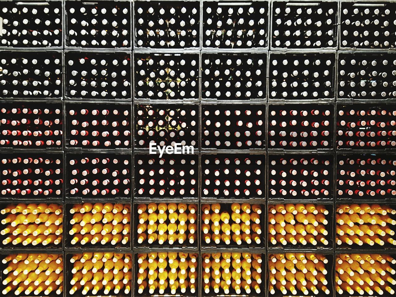 Full frame shot of drink bottles in racks